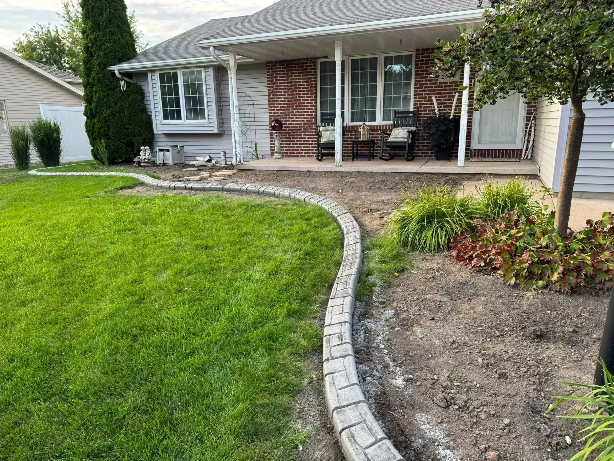 Tree ring curbing in residential landscape Tree ring curbing in residential landscape